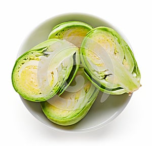 Bowl of Brussels sprouts isolated on white from above