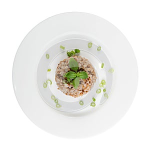 Bowl of Buckwheat Porridge Isolated on White Background Top View