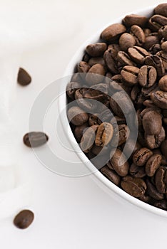 Bowl of coffee beans on a white background
