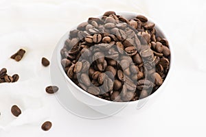 Bowl of caffee beans on a white background
