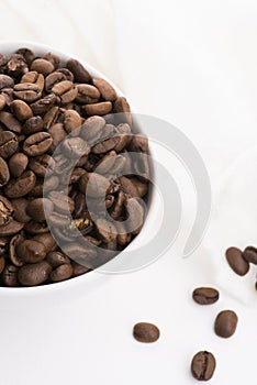 Bowl of caffee beans on a white background