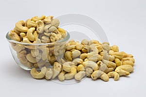 A bowl of cashew nuts on white background