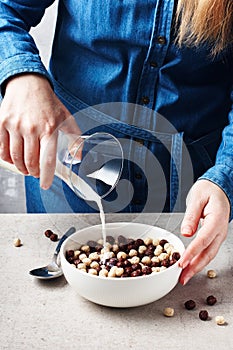 A bowl of cereal, chocolate balls