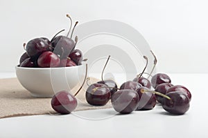 Bowl of cherries isolated on white background