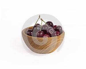 Bowl with cherries isolated on white background.