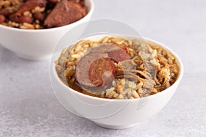 Bowl of Chicken and Sausage Gumbo with Red Beans and Rice with Sausage on the Side