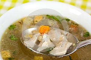 A Bowl of chicken soup with selective focus photo