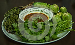 Bowl of chili with peppers and beans