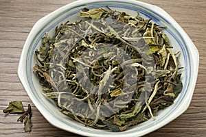 Bowl with Chinese Pai Mu Tan tea close up