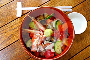 Bowl of chirashi sushi over rice