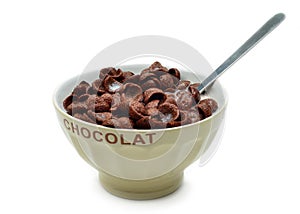 Bowl with chocolate cornflakes, cereals and milk