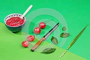 Bowl of chopped tomatoes on green table