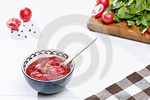 Bowl of chopped tomatoes on rustic table