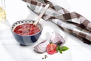 Bowl of chopped tomatoes on rustic table