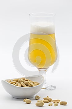 Bowl of cocoa and glass of beer on white background