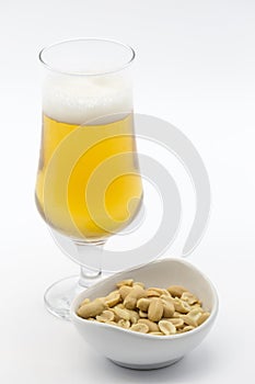 Bowl of cocoa and glass of beer on white background