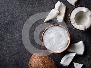 Bowl of coconut oil and fresh coconut photo