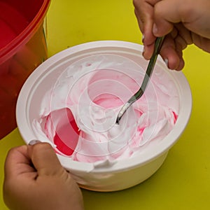 Bowl with a colorful slime, making a slime at a birthday party, children`s games - making a slime