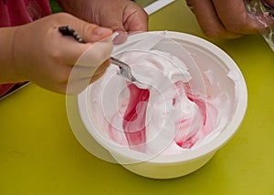 Bowl with a colorful slime, making a slime at a birthday party, children`s games - making a slime