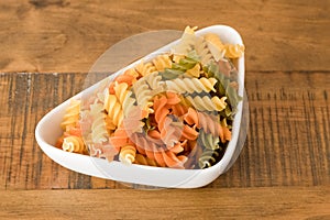Bowl of Coloured Pasta Twirls