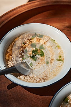 A bowl of congee or porridge with boiled rice