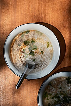 A bowl of congee or porridge with boiled rice