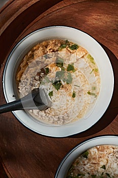 A bowl of congee or porridge with boiled rice