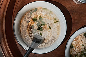 A bowl of congee or porridge with boiled rice