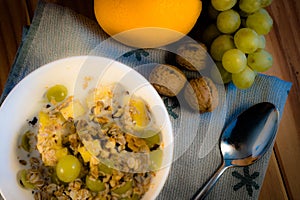Bowl containing yogurt, grains and fruit photo