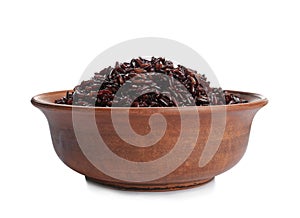 Bowl of cooked brown rice on white