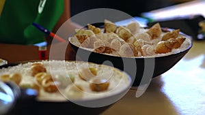 Bowl of cooked gourmet snails on salt