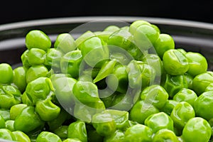 A bowl of cooked green peas