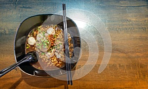 Bowl of Cooked Instant Noodles with Fish Balls and Additional Toppings