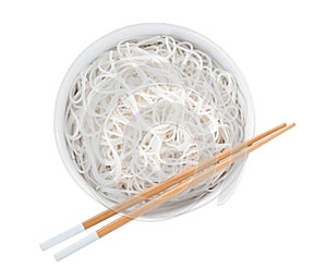 Bowl with cooked rice noodles and chopsticks isolated on white, top view