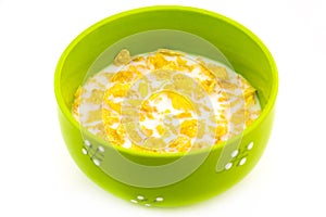 Bowl of corn flake with milks isolated on white