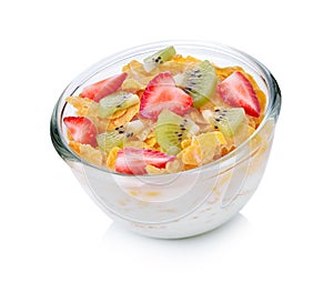 Bowl of corn flakes with milk and fruit