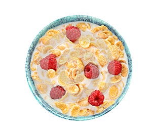 Bowl with corn flakes, milk and raspberries