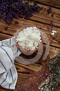 bowl with cottage cheese on wooden table