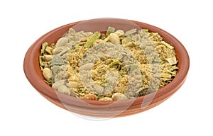 Bowl of couscous with pine nuts and seasonings