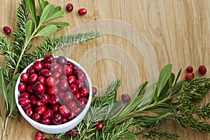 A Bowl of Cranberries with Seasonal Greens