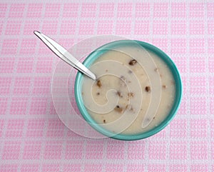 Bowl of cream of mushroom soup with spoon