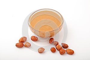 Bowl of creamy peanut butter with nuts