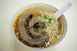 A bowl of curry beef brisket noodle soup in Macau, China