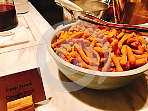 Bowl of deep fried dough stick.