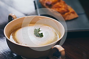 A bowl of delicious homemade cream of mushroom soup background