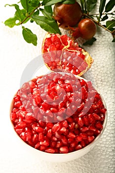 Bowl of Delicious organic red Pomegranate seeds,