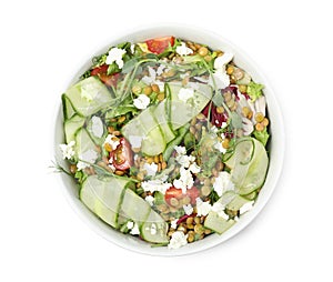 Bowl of delicious salad with lentils, vegetables and feta cheese isolated on white, top view
