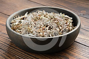 Bowl of dried Iceland moss for making healthy herbal cough tea.  Icelandic moss, natural cough medicine.