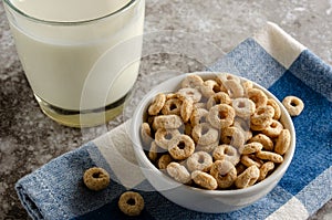 Bowl Of Dry Oat Cereal And Glass of Milk