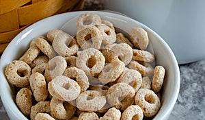 Bowl Of Dry Oat Cereal In White Bowl
